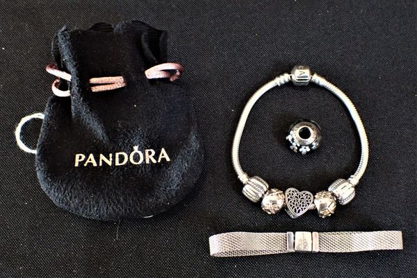 A PANDORA SILVER CHARM BRACELET