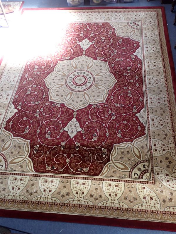 A LARGE MACHINE-MADE PERSIAN STYLE CARPET