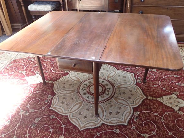 A GEORGE II STYLE MAHOGANY DROP LEAF DINING TABLE