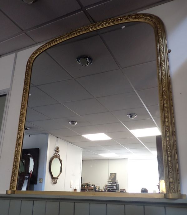 A VICTORIAN STYLE ARCHED OVERMANTEL MIRROR