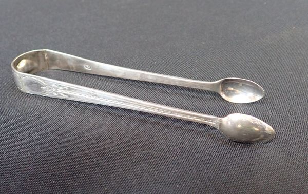 A PAIR OF SILVER SUGAR TONGS