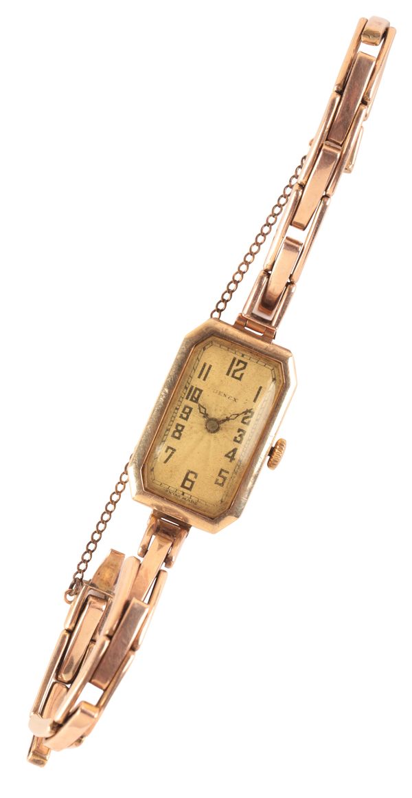 GENEX: A LADY'S 14CT GOLD BRACELET WATCH