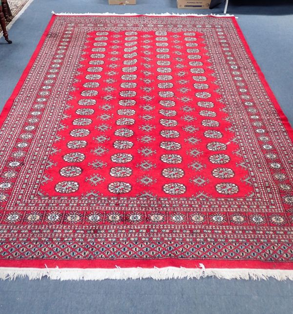 A RED GROUND PAKISTAN BOKHARA CARPET