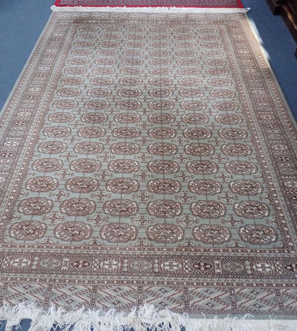 A PALE GREEN GROUND PAKISTANI BOKHARA CARPET