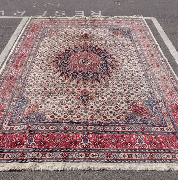 A LARGE INDIAN CARPET OF KIRMAN DESIGN