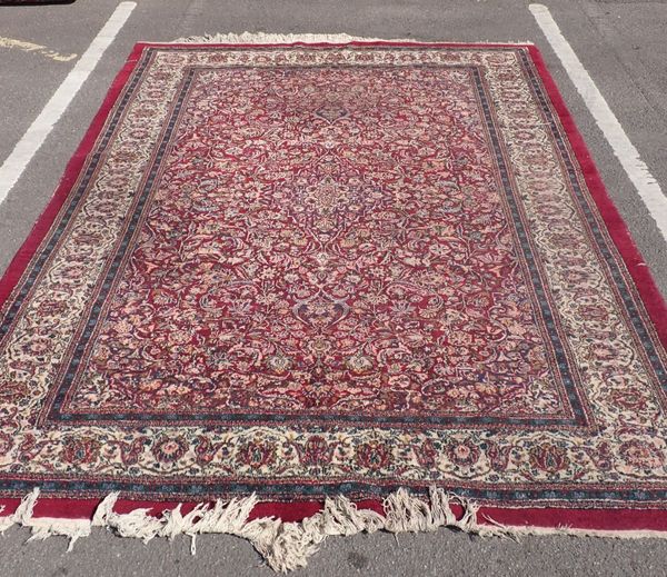 A LARGE INDIAN CARPET OF KASHAN DESIGN