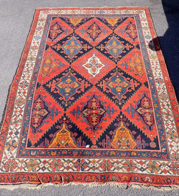 AN ANTIQUE HAMEDAN  RUG