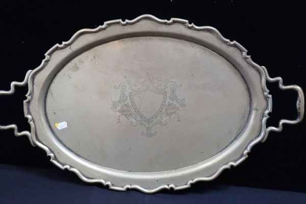 A SILVER-PLATED TRAY WITH ENGRAVED VACANT SHIELD