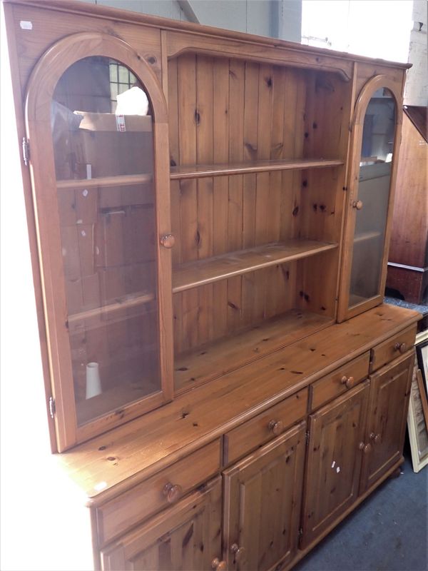 A PINE DRESSER, THE RACK WITH GLAZED CUPBOARDS