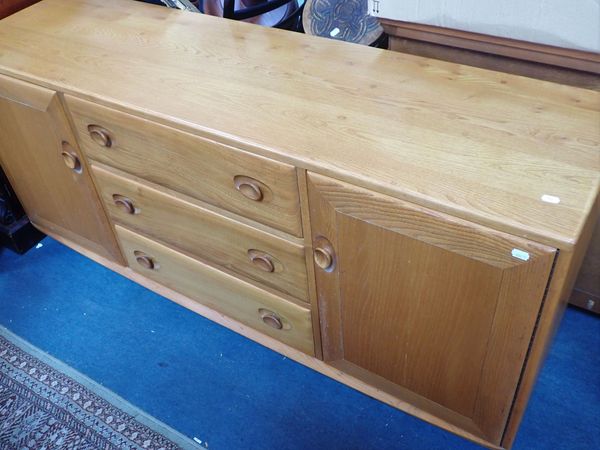 AN ERCOL LIGHT ELM WINDSOR SIDEBOARD