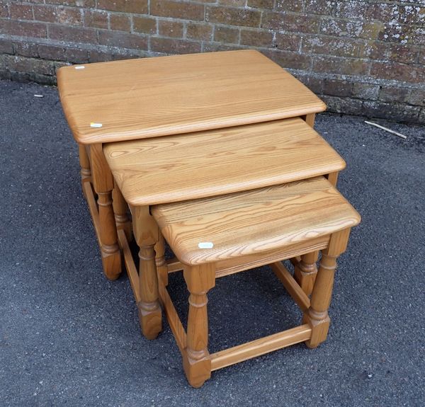 A NEST OF THREE ERCOL ELM  OCCASIONAL TABLES