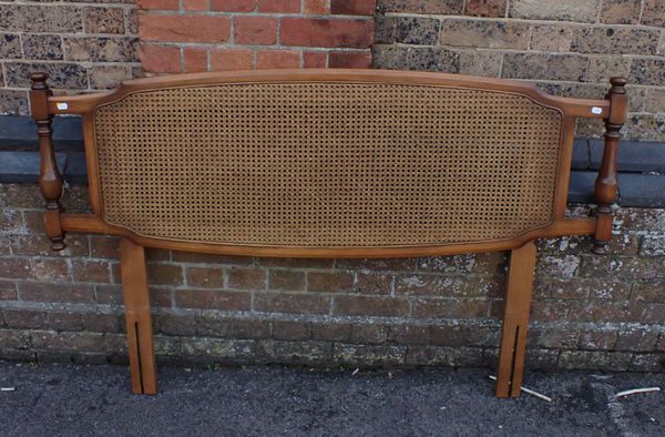 AN ERCOL CANED DOUBLE BEDHEAD