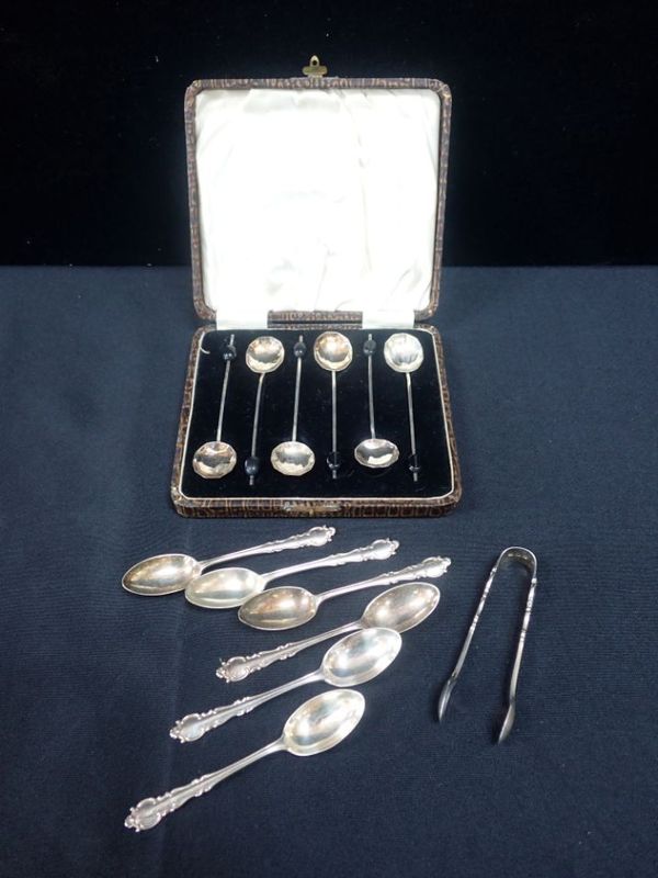 A SET OF SIX SILVER COFFEE SPOONS WITH MATCHING  SUGAR TONGS