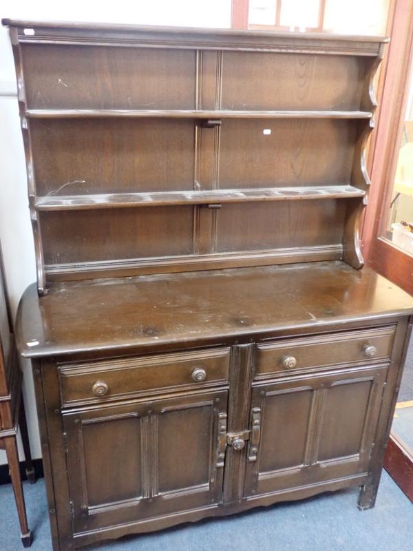 AN ERCOL DARK ELM DRESSER