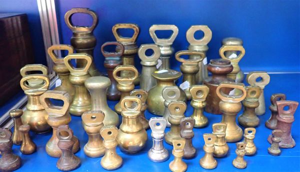 A COLLECTION OF BRASS BELL WEIGHTS, AND SIMILAR