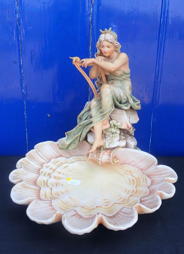 A ROYAL DUX PORCELAIN SHELL CENTREPIECE; A HARPIST MAIDEN