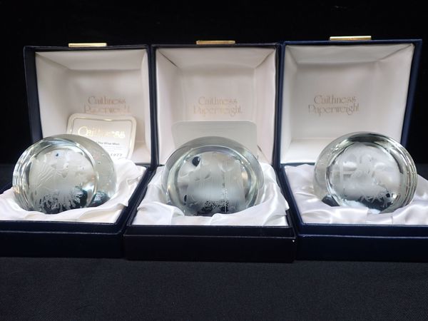 THREE INDIVIDUALLY BOXED ENGRAVED CAITHNESS CHRISTMAS PAPERWEIGHTS