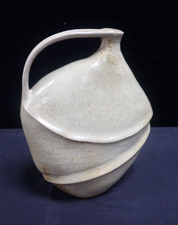 A FREE-FORM STUDIO POTTERY JUG