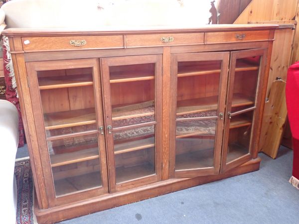 A VICTORIAN OAK GLAZED BOOKCASE