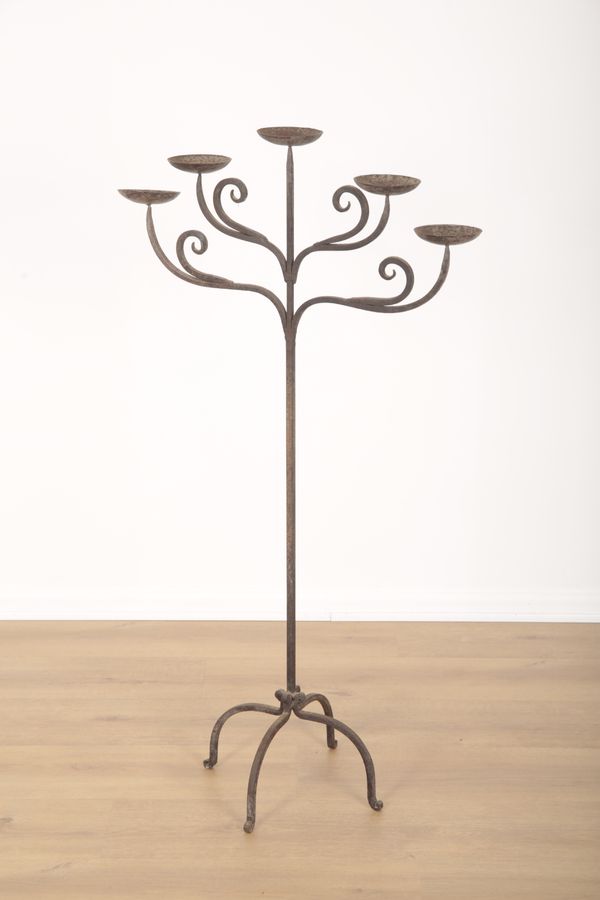 A WROUGHT IRON FLOOR STANDING CANDELABRA