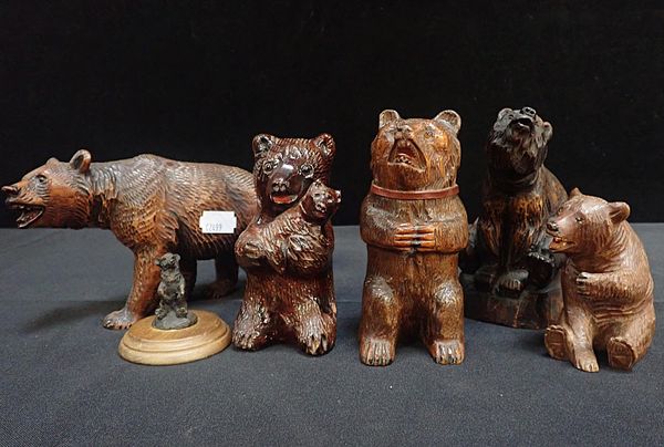 A GROUP OF FIVE BLACK FOREST STYLE WOODEN BEARS
