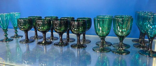 A SET OF EIGHT 19th CENTURY GREEN WINE GLASSES