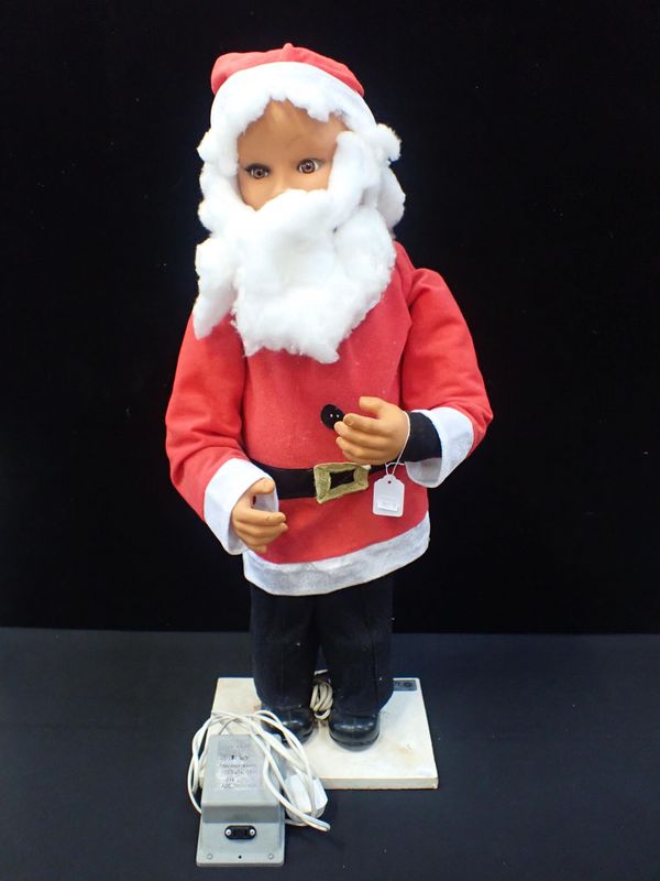 A SHOP DISPLAY AUTOMATON OF A CHILD DRESSED AS FATHER CHRISTMAS