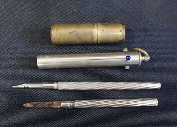 A THREE COLOUR PROPELLING PENCIL