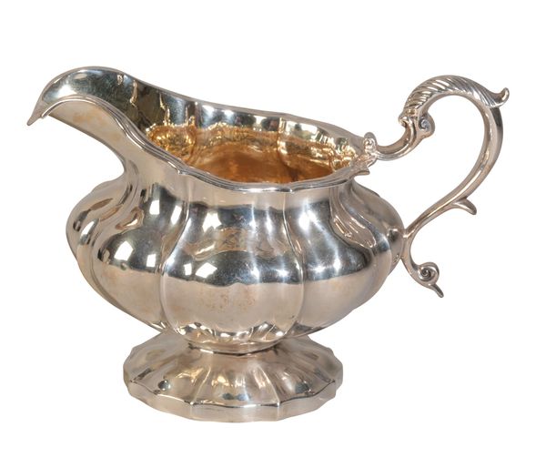 A GEORGE IV SILVER "MELON" SHAPED SAUCE BOAT