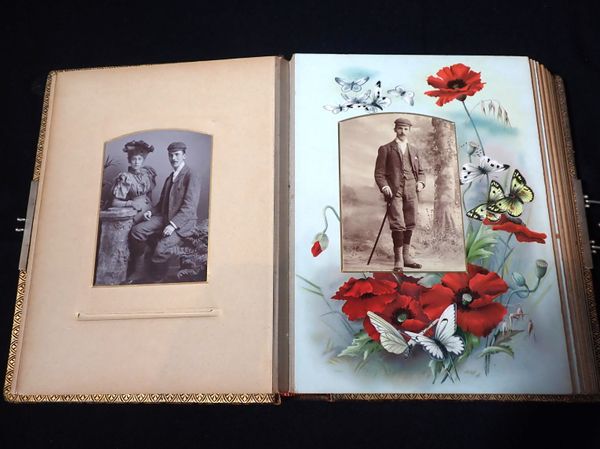 A VICTORIAN BROWN LEATHER PHOTOGRAPH ALBUM