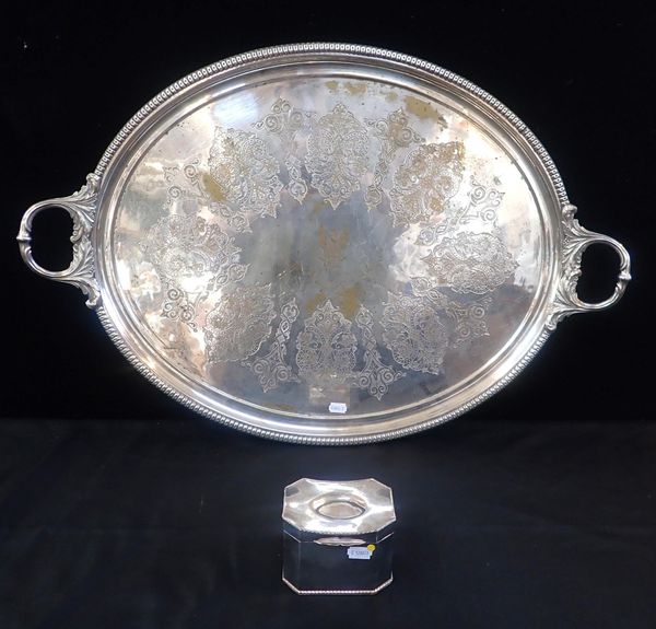 A LARGE TWIN HANDLED SILVER-PLATED TRAY