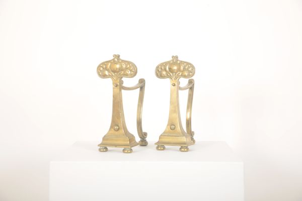 A PAIR OF BRASS ARTS AND CRAFTS FIRE DOGS OR ANDIRONS