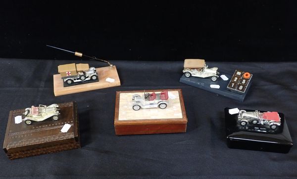 A GROUP OF MODEL CAR MOUNTED DESK ORNAMENTS AND BOXES
