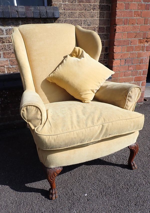 A GEORGE III STYLE WING ARMCHAIR
