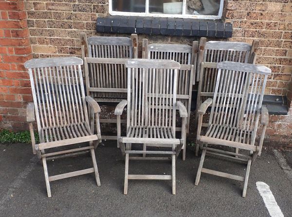 A SET OF SIX TEAK GARDEN ARMCHAIRS