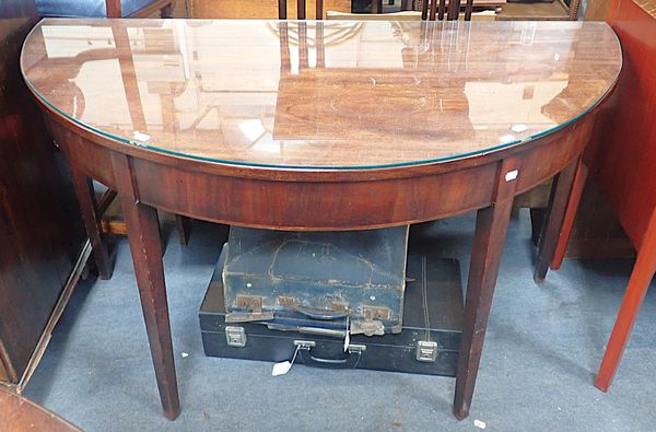 A MAHOGANY DEMI-LUNE TABLE, ON SQUARE TAPERING LEGS