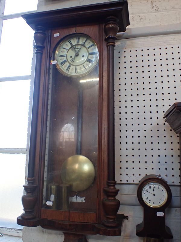 A WALNUT-CASED VIENNA STYLE WALL CLOCK