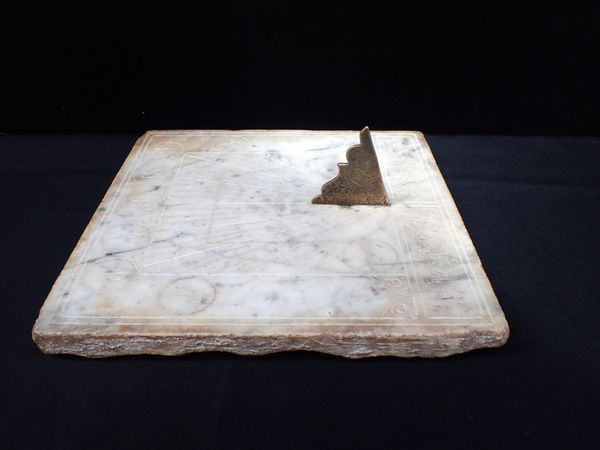 A PERSIAN MARBLE SUNDIAL