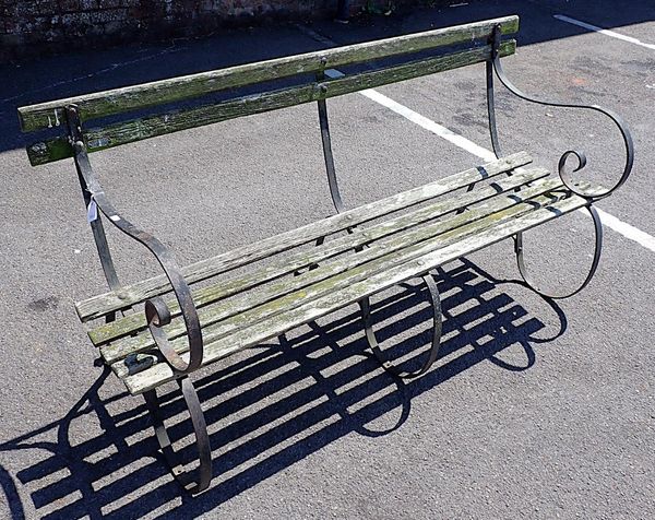 A SCROLLED IRON GARDEN BENCH