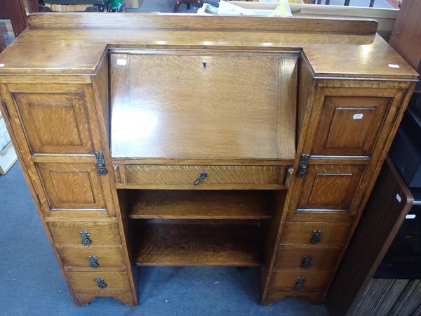 A 1920s OAK BUREAU CABINET