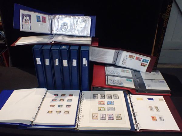 STAMPS IN 15 VOLUMES WITH A F. USED JERSEY COLLECTION