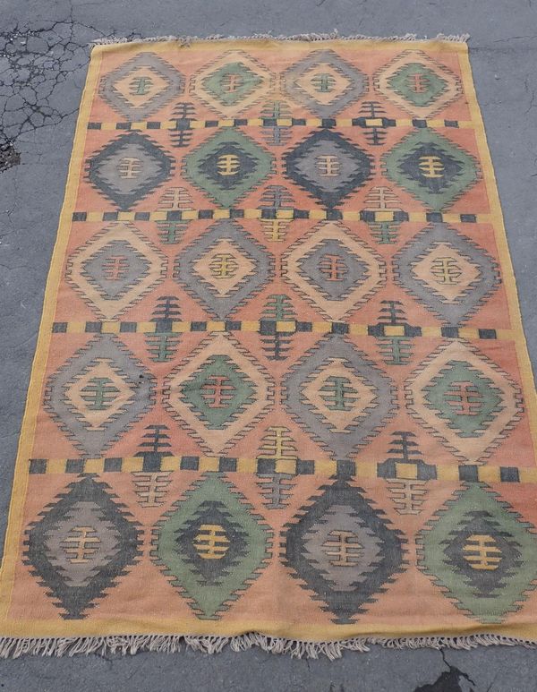 A FLATWEAVE RUG
