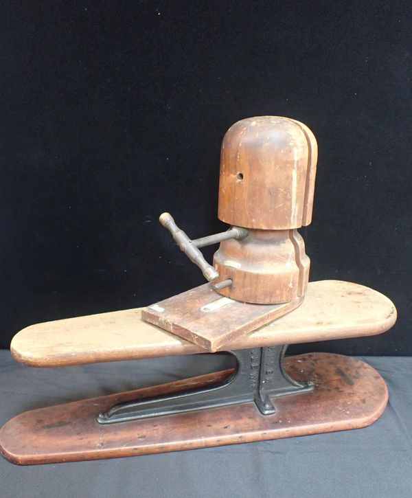 AN OLD MILLINER'S HAT STRETCHING BLOCK