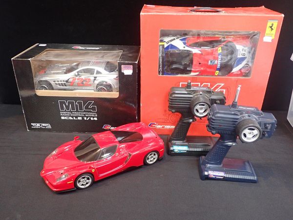 TWO BOXED 'CARISMA' M14 RC MODEL CARS