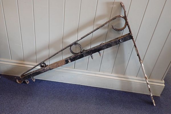 AN IRON HANGING SIGN BRACKET