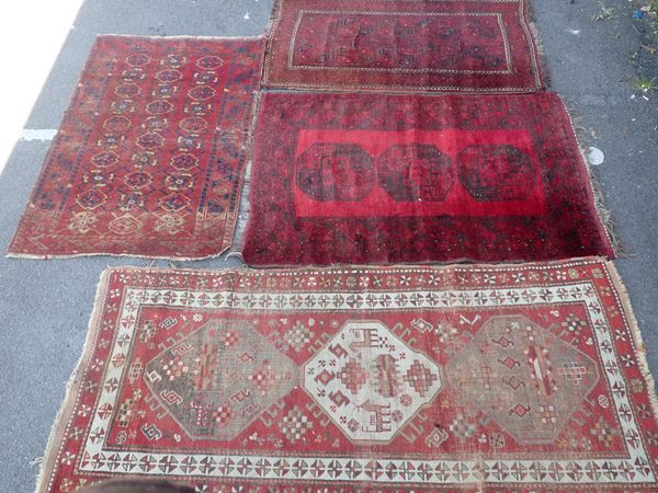 A COLLECTION OF FOUR RUGS