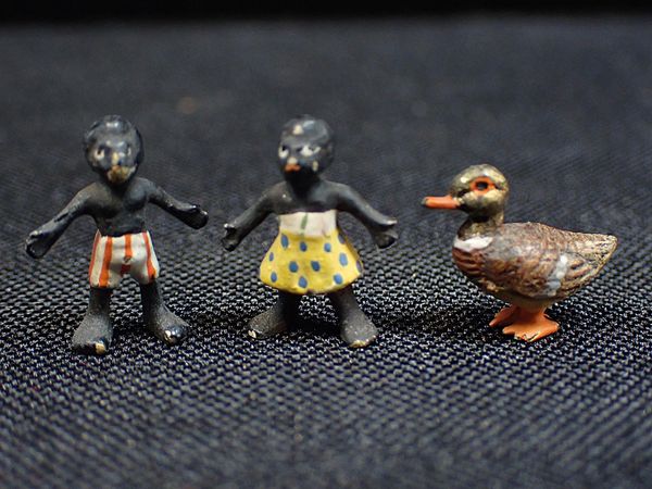 A PAIR OF MINIATURE COLD-PAINTED BRONZE BLACK CHILDREN