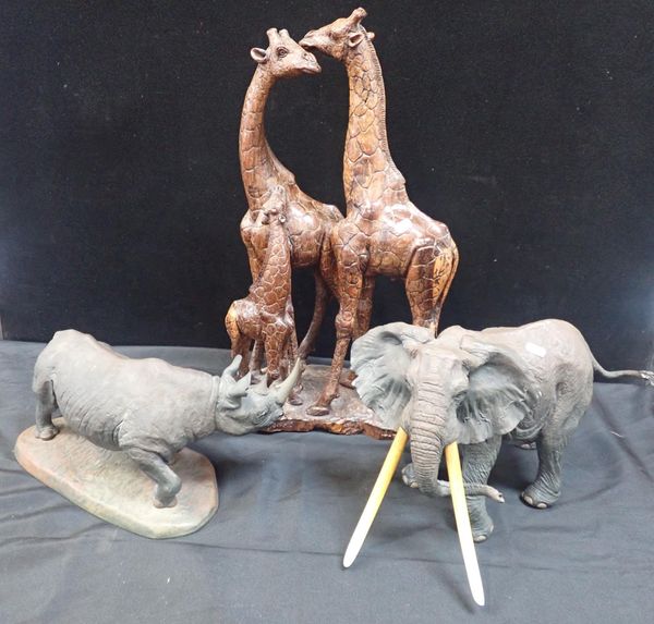 THREE RESIN BRONZE SCULPTURES OF A FAMILY OF GIRAFFES, AN ELEPHANT AND A RHINOCEROS