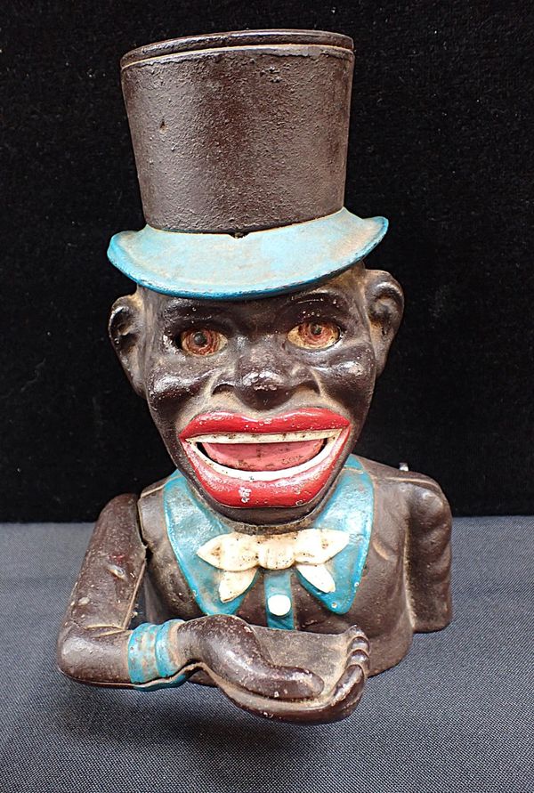 A CAST IRON NOVELTY MECHANICAL MONEY BANK