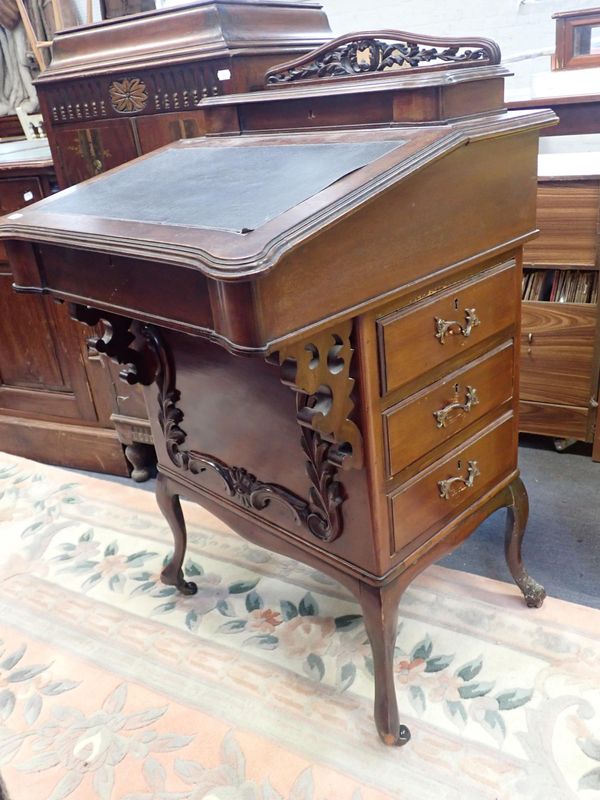 A LATE VICTORIAN MAHOGANY DAVENPORT